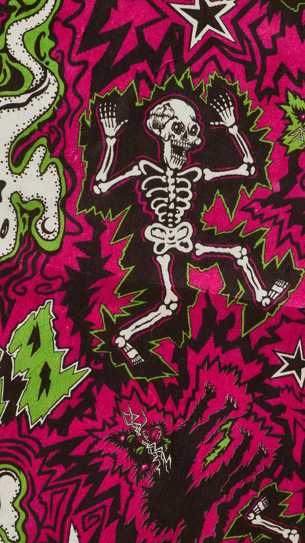 A close-up of Lush "Screech" Lokta wrapping paper with a busy, jagged pink and black background. It features a comic-style Halloween illustration of a dancing white skeleton surrounded by green electric shocks, alongside a startled black cat.