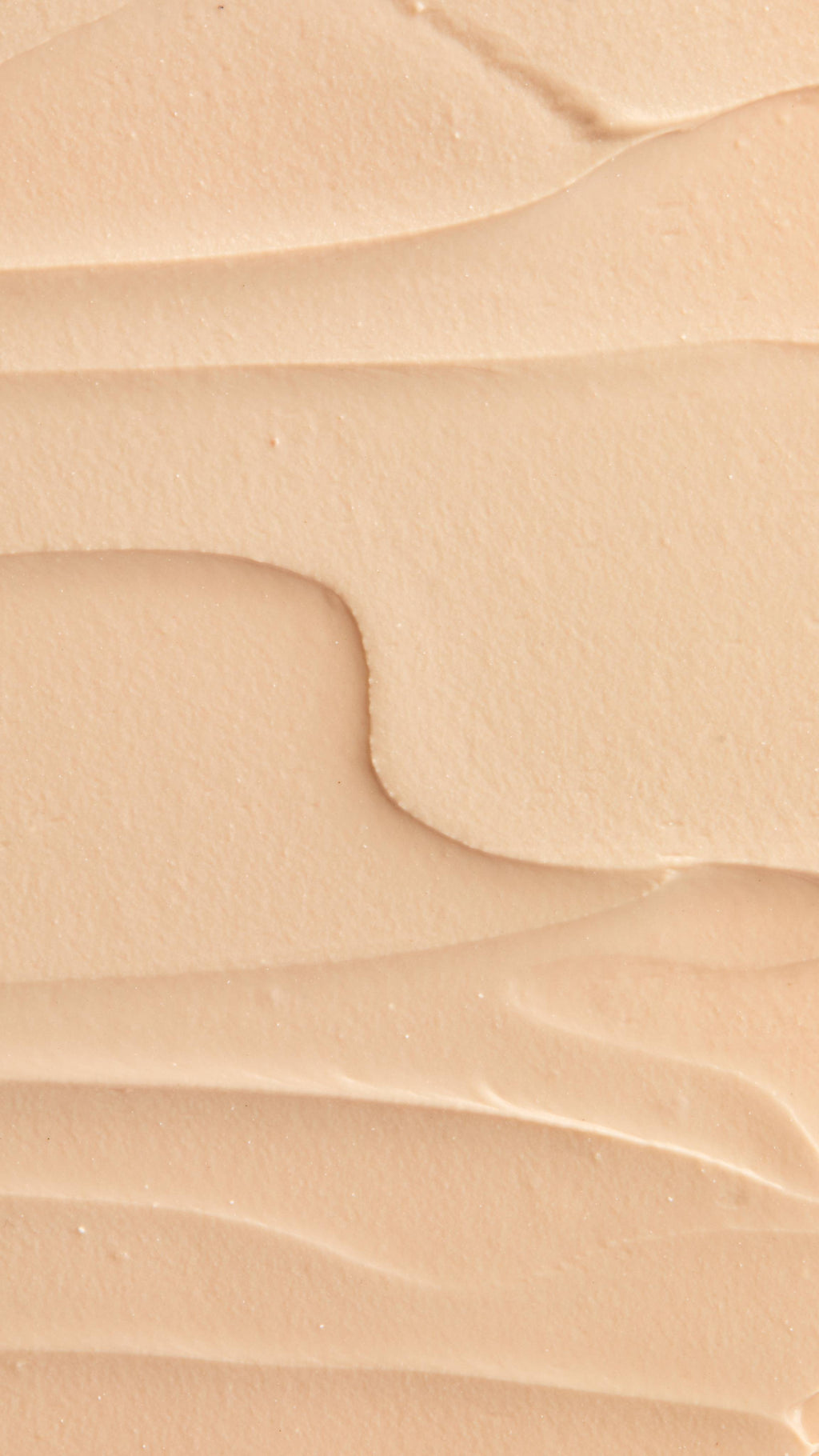 A super close-up image of the creamy, smooth Coconut Shie face mask product, focusing on the thick consistency.
