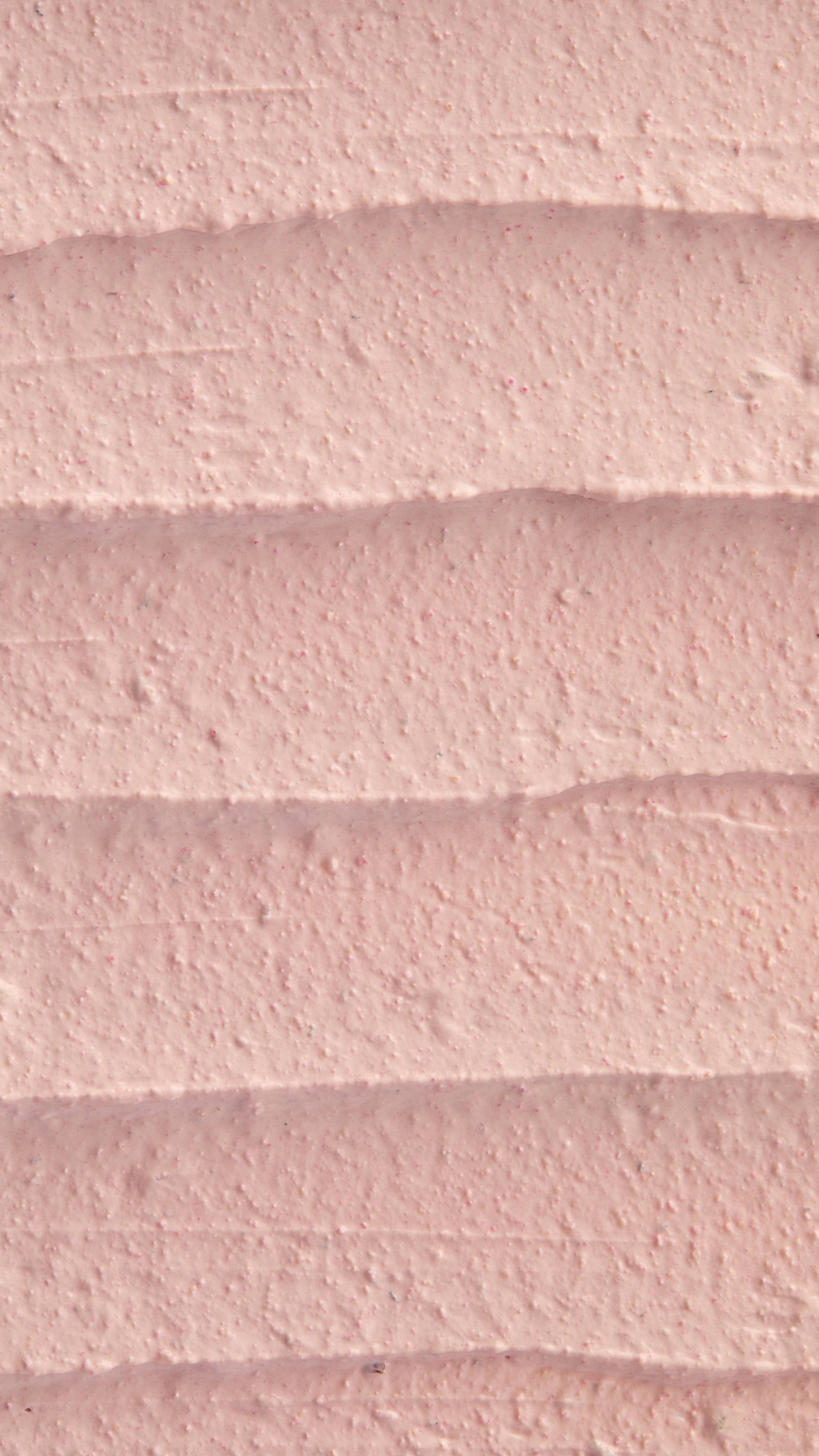 A super close-up image of the creamy, thick Mrs Whippy face mask product, focusing on the thick consistency of the flecks of finely blended fresh raspberries.