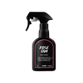 Rose Jam body spray. A black spray bottle of Lush "Rose Jam" Body Spray. The product label is black with a rose-pink banded border. White text states the product name and the scent description.