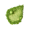 Aurora Glitter Crumble. A neatly smudged swatch of crumbly, shimmering, jade-green metallic eyeshadow.