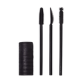 A Solid cylindrical block of black mascara next to three different style mascara spoolie brushes.