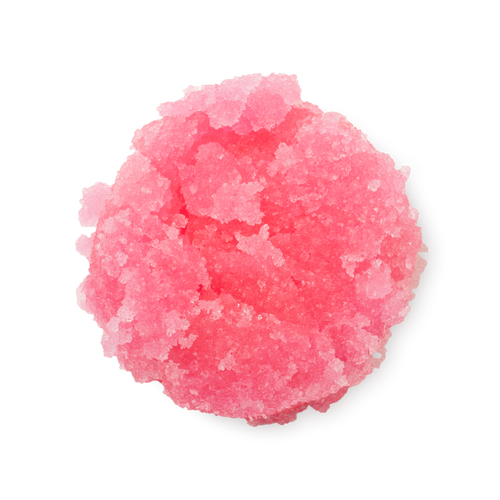 Bubblegum. A neatly piled swatch of thick, textured, vibrant pink lip scrub with visible sugar granules.