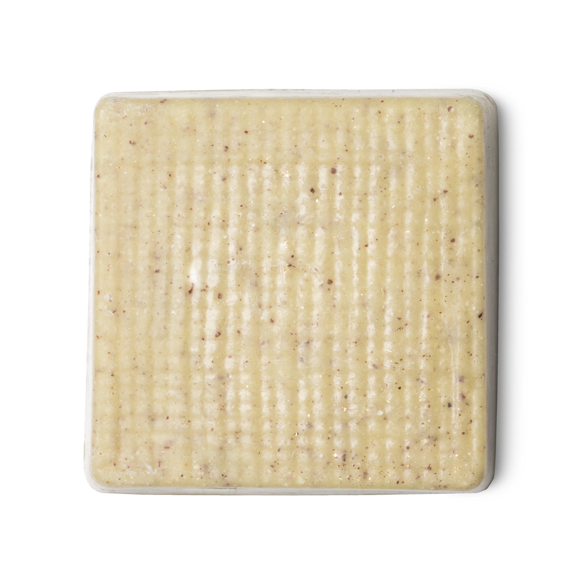 Buffy. A cream coloured, rounded square shaped, solid body butter, flecked with ground rice, almonds and aduki beans.