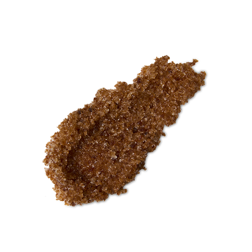 Buzz. A neatly smeared swatch of thick, textured, deep caramel-coloured lip scrub with visible sugar granules.