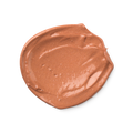 A swatch of slightly shimmery, rosy-bronze Charisma skin tint.