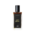 A glass perfume bottle filled with dark mahogany liquid. A black label reads 'The Perfume Library' and 'Devil's Nightcap'.