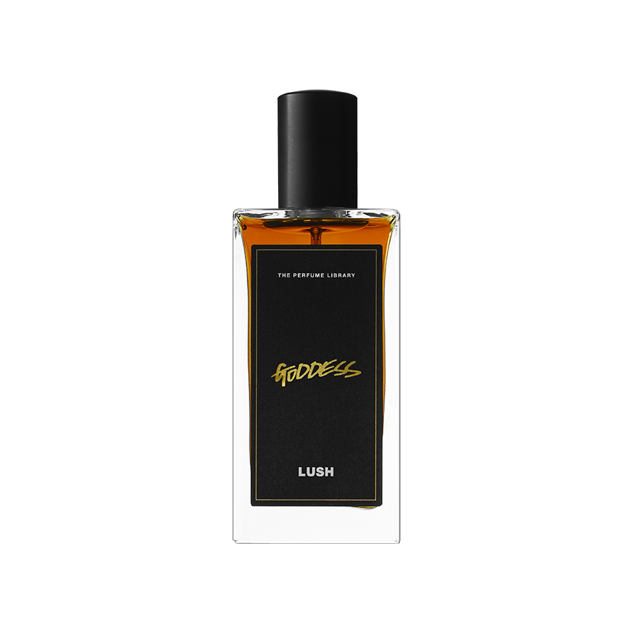 A glass perfume bottle filled with dark amber liquid. A black label reads 'The Perfume Library' and 'Goddess'.