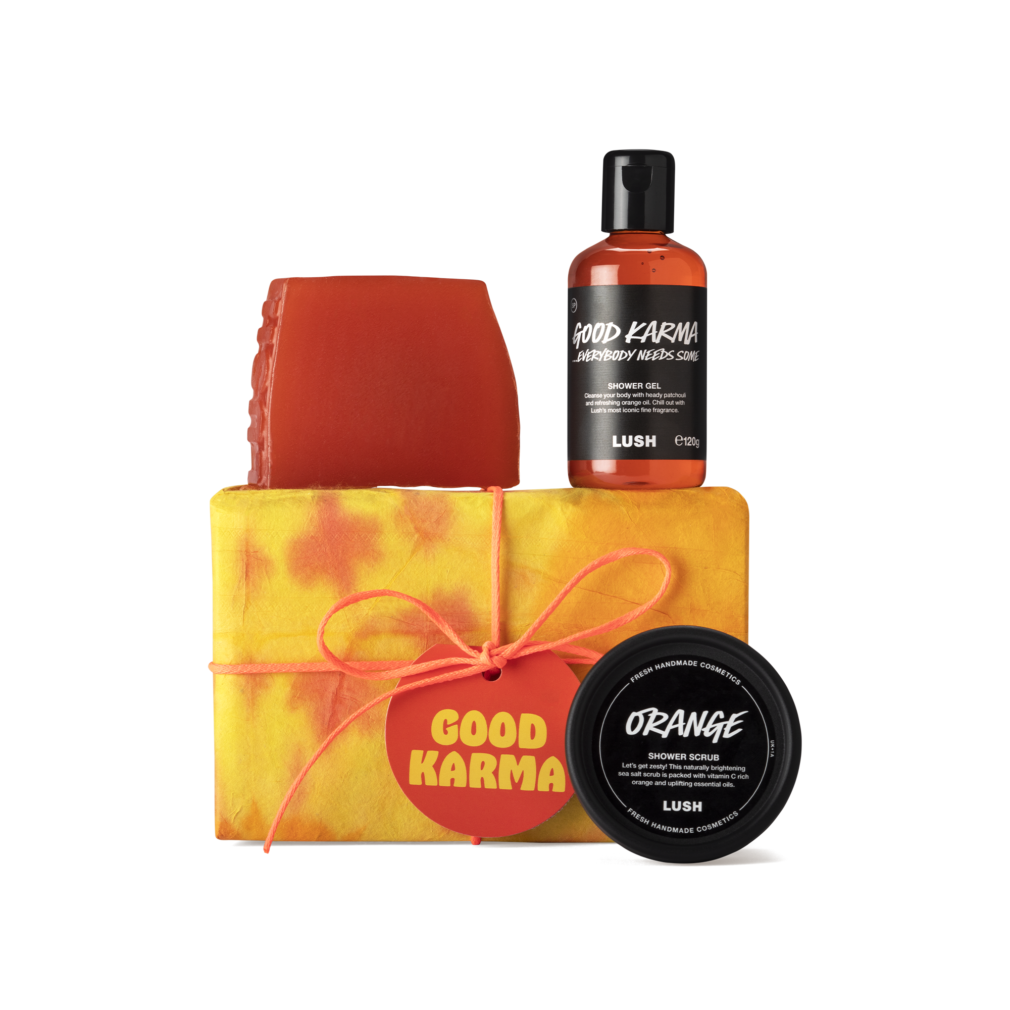 Good Karma. A rectangular box, wrapped in yellow and orange tie-dye paper, tied with orange cord and an orange gift tag.