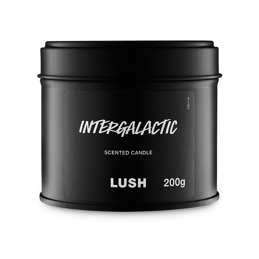 Intergalactic. A round, black, candle tin with a removable lid. The black label on the front reads "Intergalactic" in white text.