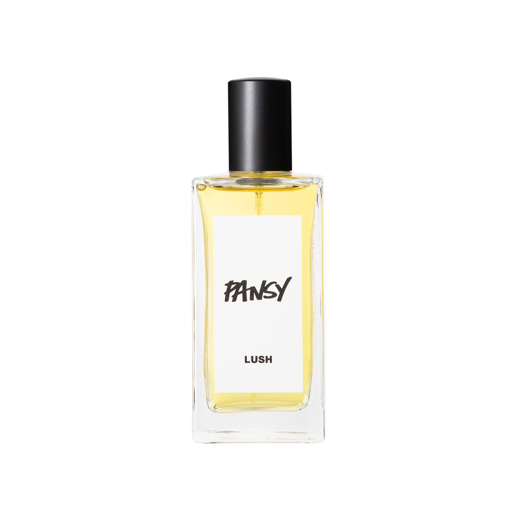 A glass perfume bottle filled with pale yellow liquid. A white label reads 'Pansy'.