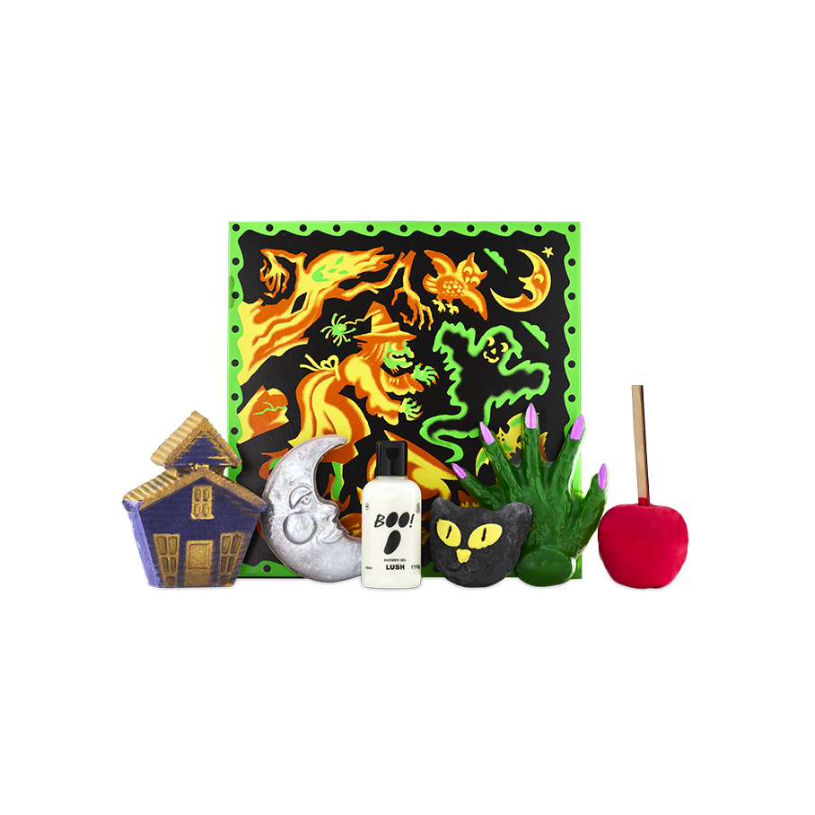 Season of the Witch gift. A colourful witch-themed gift box stands behind an array of six Halloween-themed bathing products, including bath bombs, a shower gel, a bubble bar and a shower gummy.