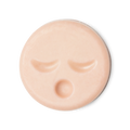 Sleepy Face. A circular, pale peachy pink naked cleansing balm, engraved with little yawning face.