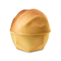 Sticky Dates. A golden, spherical bath bomb with a slightly rippled top half and a geometric base. The product is topped with shimmering, golden lustre.