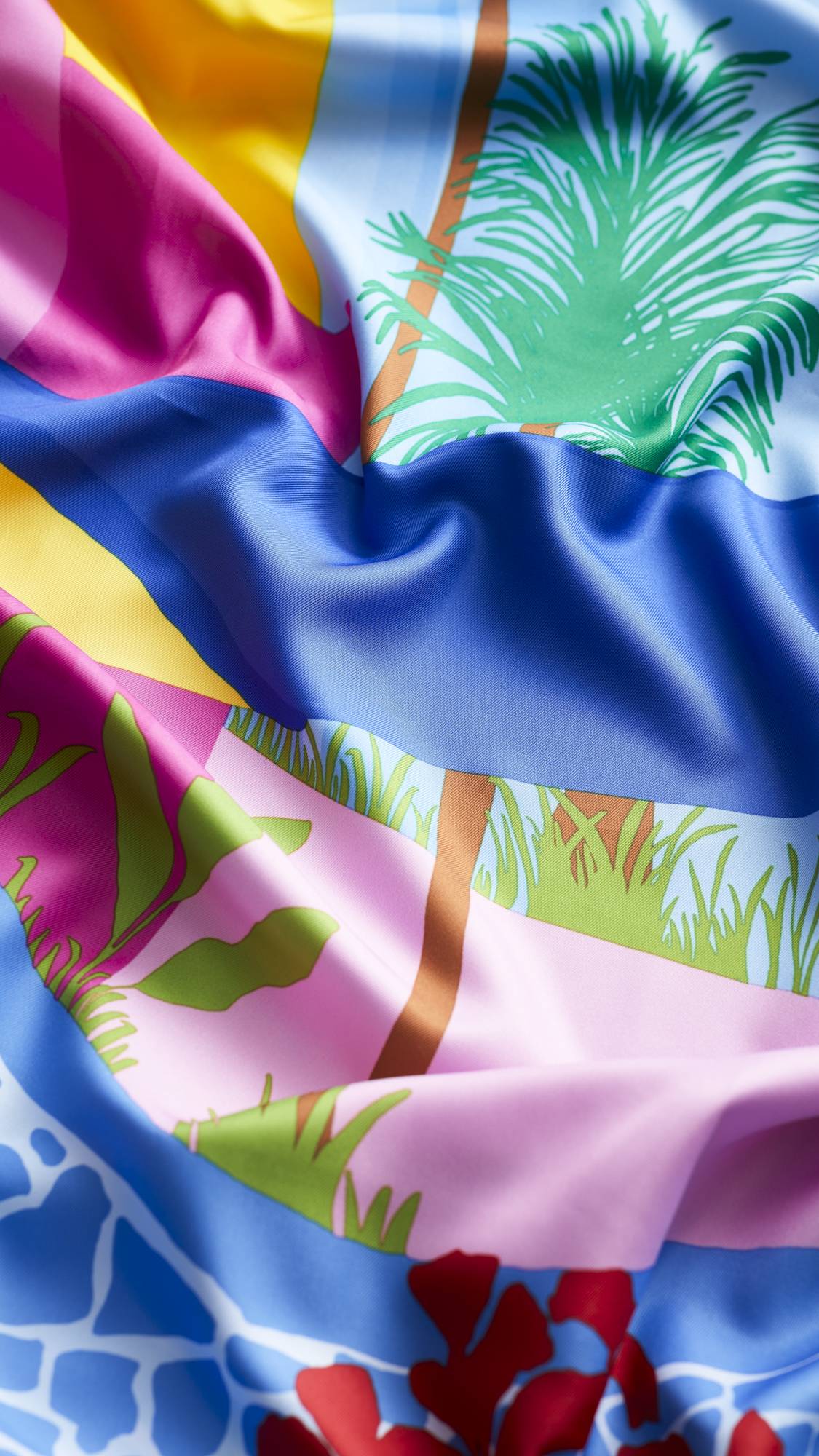 The image shows a close-up of the Summer Daydreams knot wrap focusing on the sheen of the fabric.