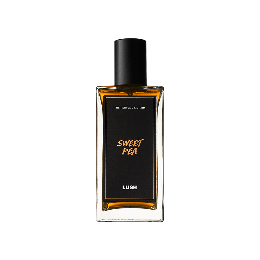 Sweet Pea. A rectangular, glass perfume bottle with a black cap is filled with translucent, dark-amber liquid. A black label reads 'Sweet Pea'.