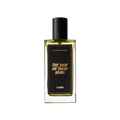 A Dew On Their Hems. A rectangular, glass perfume bottle with a black cap is filled with translucent, amber liquid. A black label reads 'The Dew On Their Hems'.