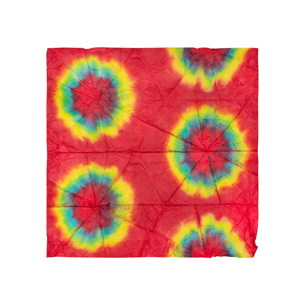A square Lokta Wrap with red, green and yellow tie-dyed designs all over.