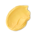 Turmeric And Argan. A neatly smudged swatch of creamy, soft, buttery-yellow facial cleanser.