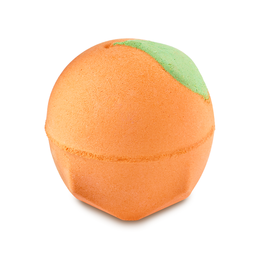 A spherical, bright orange Peachy Bath Bomb with a small green leaf detail at the top, set against a solid black background.